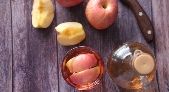 sliced apple beside black handled knife