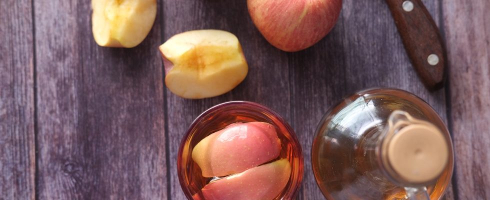 sliced apple beside black handled knife